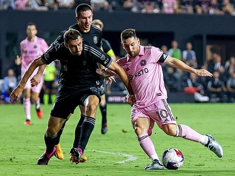 Inter Miami's Lionel Messi (R) fights for the ball with Nashville's Jack Maher (L) during the Major League Soccer (MLS) football match at DRV PNK Stadium in Fort Lauderdale, Florida, on August 30, 2023.