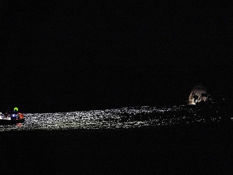 In this photo provided by NASA, support teams work around a SpaceX capsule shortly after it splashed down in the Atlantic Ocean off the coast of Jacksonville, Fla., Monday, Sept. 4, 2023, with NASA astronaut Stephen Bowen, United Arab Emirates astronaut Sultan al-Neyadi, NASA astronaut Warren (Woody) Hoburg and Roscosmos cosmonaut Andrei Fedyaev aboard after a six-month stay at the International Space Station. (Joel Kowsky/NASA via AP)