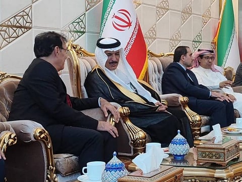 Saudi ambassador to Iran Abdullah Bin Saudi Al Anzi (second from left) talks to an Iranian official in Tehran.