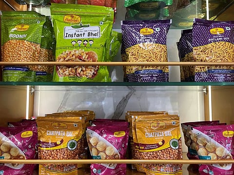 A view shows packets of snacks on the shelves inside a Haldiram's restaurant in Mumbai, India, September 6, 2023