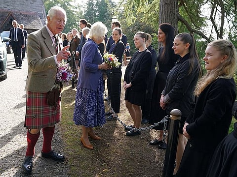 Britain's King Charles and Queen Camilla meet estate staff and members of the public, as they leave Crathie Parish Church, near Balmoral, Scotland, Britain, after a church service, to mark the first anniversary of the death of Queen Elizabeth II, Friday September 8, 2023.