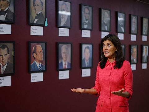 Republican presidential candidate and former U.S. Ambassador to the United Nations Nikki Haley photographed in front of portraits of past U.S. Presidents at the Founders Academy charter school in Manchester, New Hampshire