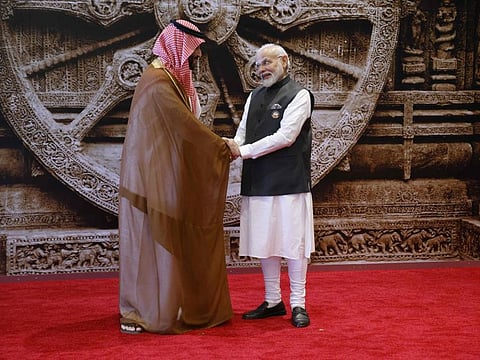 India's Prime Minister Narendra Modi (R) shakes hand with Saudi Arabia's Crown Prince and Prime Minister Mohammed bin Salman ahead of the G20 Leaders' Summit in New Delhi on September 9, 2023.