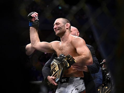 American Sean Strickland celebrates defeating Nigerian-born New Zealander Israel Adesanya to claim the middleweight title by unanimous decision in the main event of UFC 293 in Sydney on Sunday, Sept. 10, 2023. (Dan Himbrechts/AAP Image via AP)
