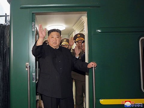 This Sept. 10, 2023 photo provided by the North Korean government shows that North Korea leader Kim Jong Un waves from a train in Pyongyang, North Korea, as he leaves for Russia.