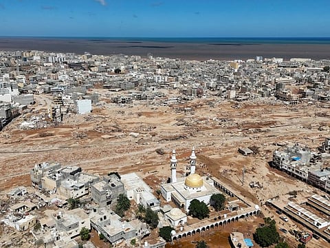 A general view of the flooded city of Derna, Libya, is seen Wednesday, Sept. 13, 2023. The rainwater that gushed down Derna's mountainside and into the city has killed thousands and left thousands more missing, washing entire neighborhoods out to sea. AP Photo/Muhammad J. Elalwany)