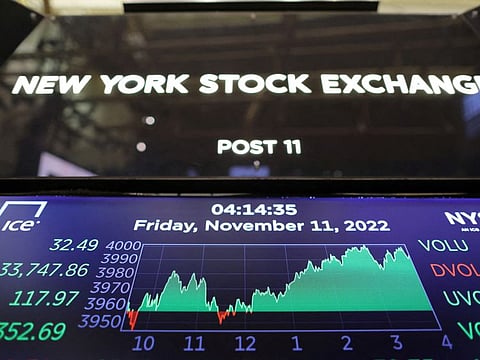 FILE PHOTO: The Dow Jones Industrial Average (DJI) is seen after the market close on the trading floor at the New York Stock Exchange (NYSE) in Manhattan, New York City, U.S., November 11, 2022. REUTERS/Andrew Kelly/File Photo