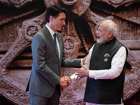 India's Prime Minister Narendra Modi (R) shakes hand with Canada's Prime Minister Justin Trudeau ahead of the G20 Leaders' Summit in New Delhi.
