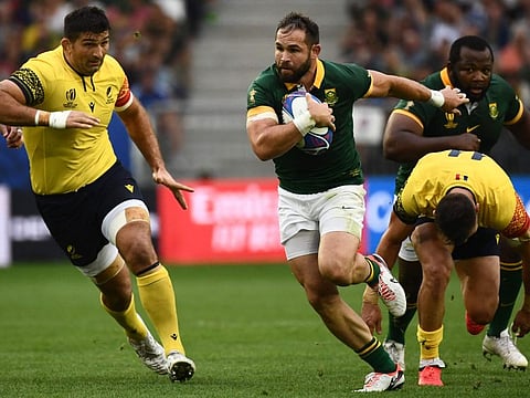 South Africa's scrum-half Cobus Reinach runs to score the team's third try during the Rugby World Cup Pool B match against Romania at Stade de Bordeaux in Bordeaux on Sunday.