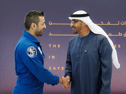 President Sheikh Mohamed bin Zayed Al Nahyan (right) with Sultan Al Neyadi upon his return to the UAE