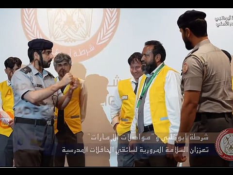 Still from police video showing officers interacting with school bus drivers