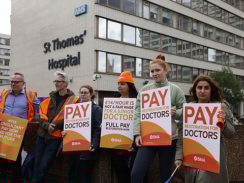 Health workers protest about pay during joint strike action by consultants and junior doctors outside St Thomas' Hospital in central London, UK, on Wednesday, Sept. 20, 2023.