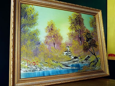 "A Walk in the Woods," the first painting Bob Ross produced for hic iconic show “The Joy of Painting,” sits on display at the home of Modern Artifact owner Ryan Nelson, Tuesday, Sept. 19, 2023, in Wayzata, Minn.
