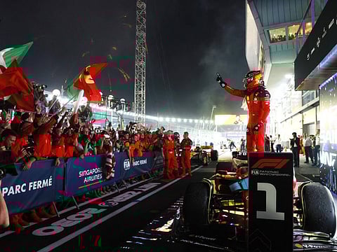 Ferrari's Carlos Sainz Jr. celebrates after winning the Singapore Grand Prix at the Marina Bay Street Circuit on September 17.