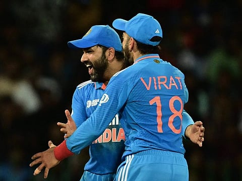India's captain Rohit Sharma and Virat Kohli celebrate a Sri Lankan wicket during the Asia Cup 2023 at the R. Premadasa Stadium in Colombo on September 11.