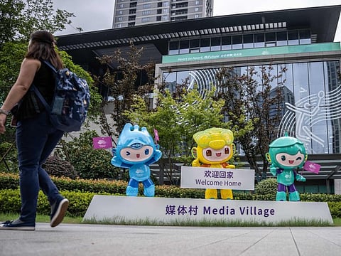 The official mascots of the 2022 Asian Games Chenchen, Congcong and Lianlian are displayed at the media village in Hangzhou on Thursday.