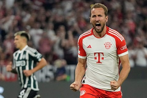Bayern's Harry Kane celebrates after scoring his side's third goal from a penalty kick during the Champions League Group A match against Manchester United on Wednesday.