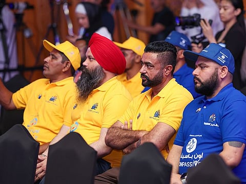 Workers at a Taqdeer Awards press conference.