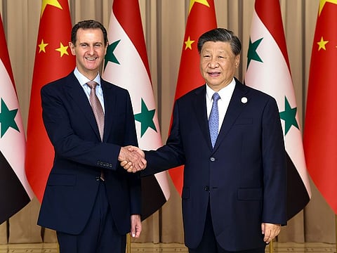 In this photo released by Xinhua News Agency, Chinese President Xi Jinping, right, shakes hands with Syrian President Bashar Assad before their bilateral meeting in Hangzhou, China, Friday, Sept. 22, 2023.