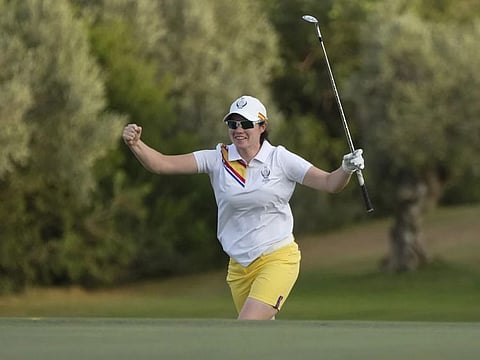 Leona Maguire of Ireland, celebrates on the 18th hole during the fourball play in the Solheim Cup on day one in Finca Cortesin, Spain