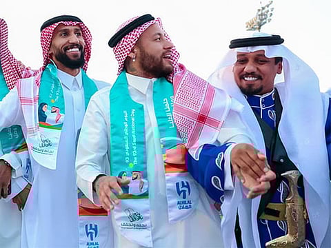 The star footballer (centre) donned a traditional Saudi uniform and joined his teammates in performing the iconic Ardha dance.