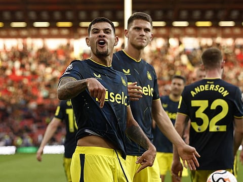 Newcastle United's Bruno Guimaraes celebrates scoring their seventh goal with Sven Botman during a Premier League match against Sheffield United on Sunday.