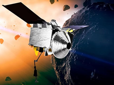 This illustration provided by NASA depicts the OSIRIS-REx spacecraft at the asteroid Bennu. Scientists believe that material gathered from an asteroid called Bennu could explain how life began on our planet.