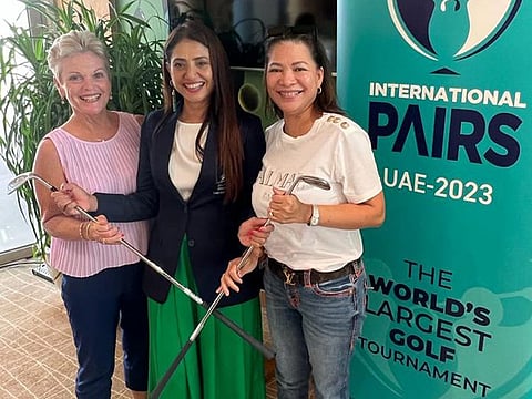 Paula Savage (left) and Joy Lirio (right) with Dubai Creek's Lady Captain Shiba Wahid