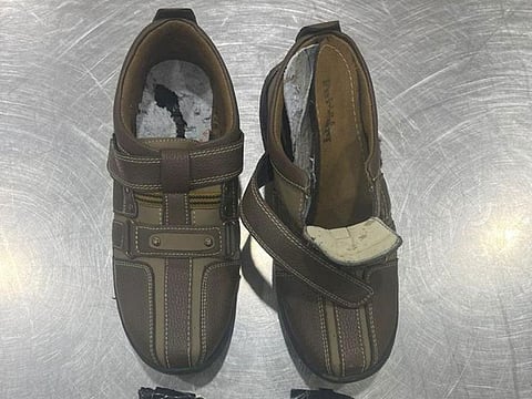 A passenger at Dubai Airports flew in with opium concealed inside his shoes. But Dubai Customs inspectors got the better of him.