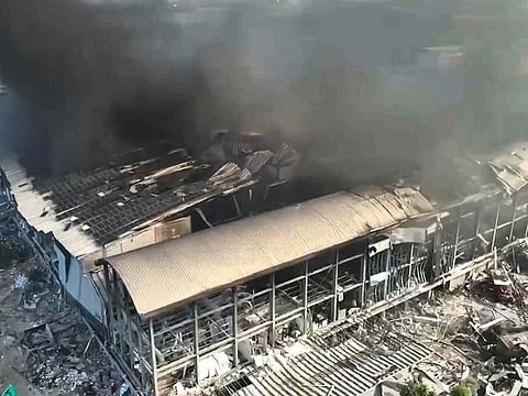 Smoke billows from a factory of golf ball manufacturer Launch Technologies Co. in the southern county of Pingtung in Taiwan.