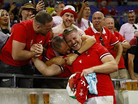 Wales' Aaron Wainwright celebrates with fans after the Pool C match against Australia at OL Stadium, Lyon, France on Sunday.