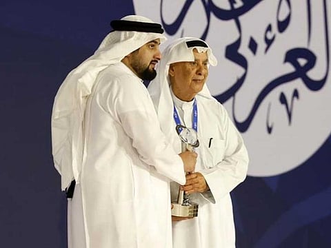 Sheikh Ahmed bin Mohammed bin Rashid Al Maktoum honours Dr Mohammed Ghanem Al Rumaihi who has won Media personality of the year at the Arab Media Forum in Dubai on Tuesday