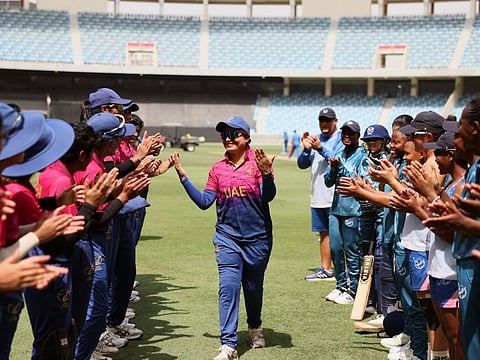UAE women's cricket team captain Chaya Mughal gets a warm send-off from her teammates and opponents at the Dubai International Cricket Stadium on Tuesday.