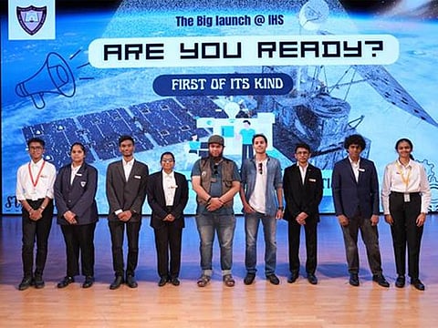 Indian High School students with alumni at the launch of their satellite-based weather station in Dubai on Tuesday.
