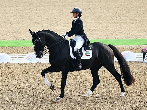 Natalie Lankester, riding Cash DXB, going through her routine in the individual dressage championship in the Asian Games on Wednesday.