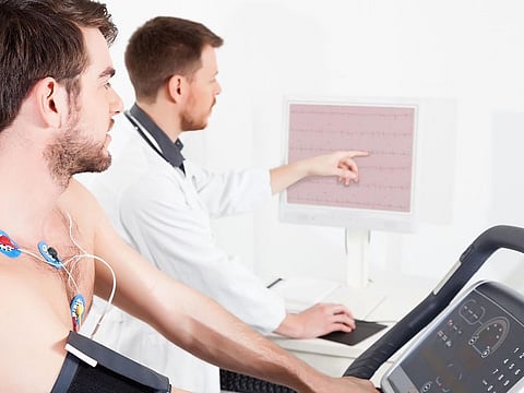 Routine investigations play a pivotal role in the diagnostic process. A doctor shows the patient an ECG recording of the heart's status.