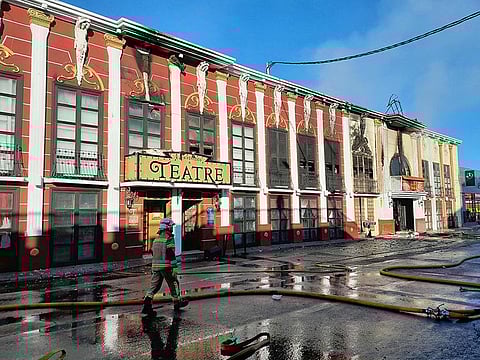 A firefighter walking past the Teatre nightclub.