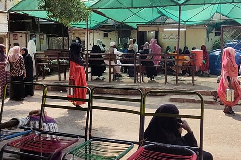 Patients wait at a hospital amid the spread of cholera and dengue fever cases, in Gadaref city in Sudan on September 27, 2023.
