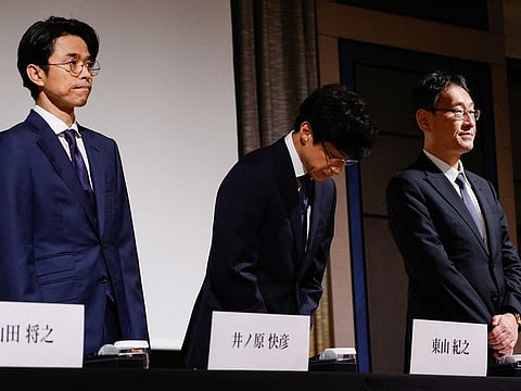 Japan's talent agency Johnny & Associates Chief Noriyuki Higashiyama, flanked by CEO of Johnny's Island Yoshihiko Inohara and their lawyer Hiroshi Kimeda, bows at the start of their news conference in Tokyo, Japan, October 2, 2023.