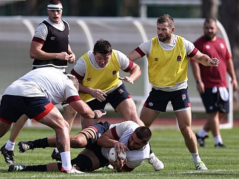 England's George Martin (centre) fights for the ball with Elliot Daly during a training session at the Stade Ferdinand Petit in Le Touquet-Paris-Plage, northern France on Monday.