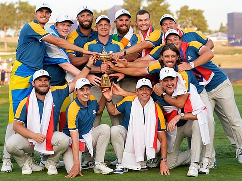Europe's Team Captain Luke Donald (centre) and team members lift the Ryder Cup after winning the trophy by defeating the United States at the Marco Simone Golf Club in Guidonia Montecelio, Italy, on Sunday.
