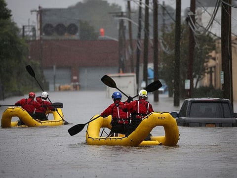 US Special Operations Unit rescue personnel with the Westchester County Emergency Services paddle in rafts as they check buildings for victims trapped in heavy flooding in the New York City suburb of Mamaroneck on September 29, 2023. Roughly half the subway lines in one of the world’s busiest metro systems were suspended or delayed. Streets and highways around the city were flooded. The city’s airports, key national hubs, faced massive delays.