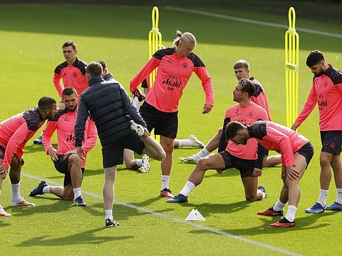 Manchester City's Erling Braut Haaland and Jack Grealish with teammates during a training session at the Etihad Campus, Manchester, on Tuesday.