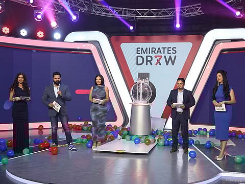 Emirates Draw presenters with the new draw machine