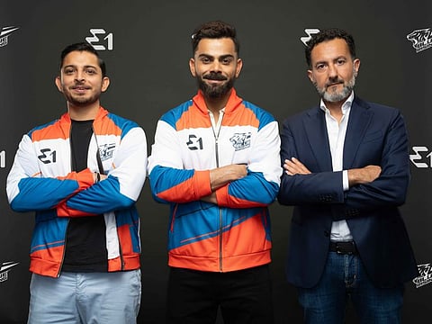 From left: Adi K Mishra, Virat Kohli, Rodi Basso. The former Indian captain recently announced the launch of his new team — Blue Rising Team — along with sports tech entrepreneur.