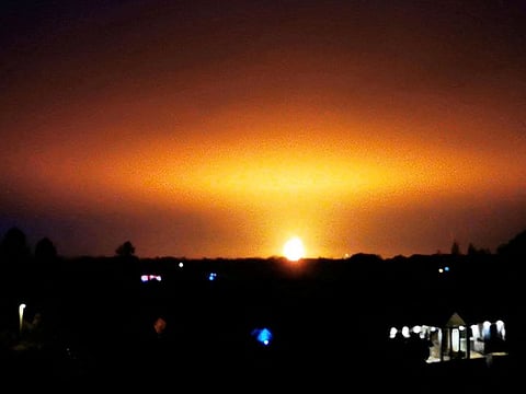 A fire believed to have been caused by a lightning strike on gas containers is pictured near the city of Oxford, Britain, in this video screengrab obtained from social media, October 2, 2023.