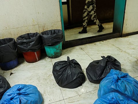 Bags containing medical waste are on the floor of the paediatric ward inside the Shankarrao Chavan Government Medical College and Hospital in Nanded.