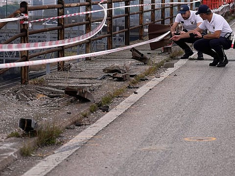 Local Police officers check the scene of a passenger bus accident in Mestre, near the city of Venice, Italy.