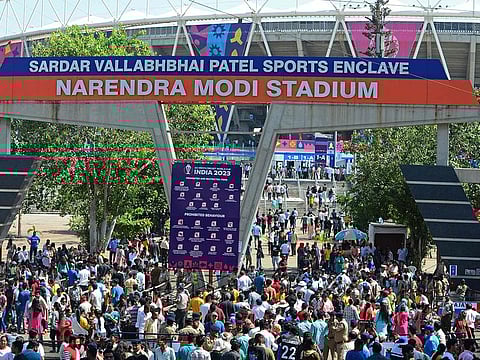 Fans arrive to watch the 2023 ICC men's cricket World Cup one-day international (ODI) match between England and New Zealand at the Narendra Modi Stadium in Ahmedabad on October 5, 2023