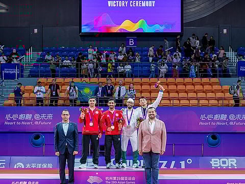 Gold medallist Khaled Al Shehi and silver medallist Khalid Al Blooshi on the podium during the medal ceremony in Hangzhou, China, on Thursday.